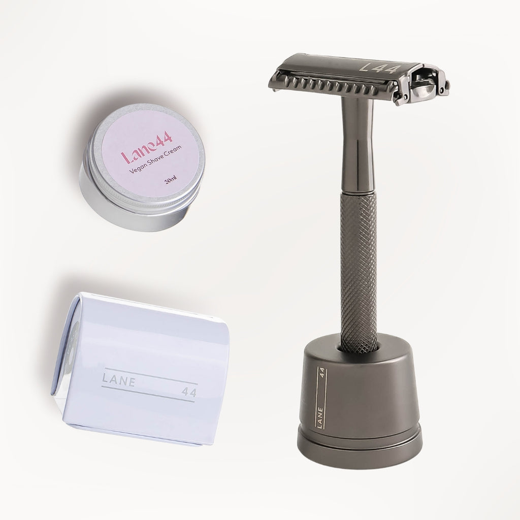 charcoal safety razor in stand with recycling bin and natural shave cream