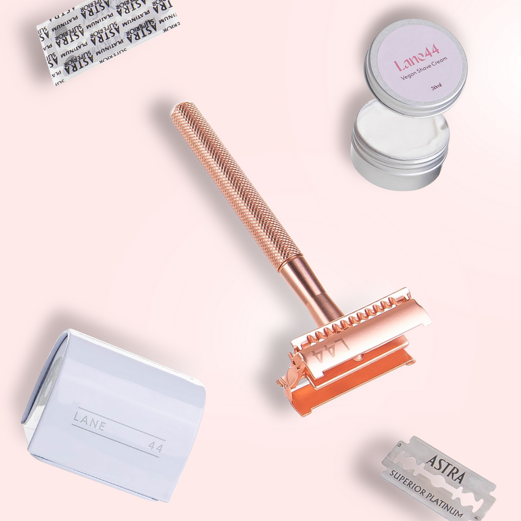 rose gold safety razor butterfly open with double edge blade recycling bin and natural shaving cream