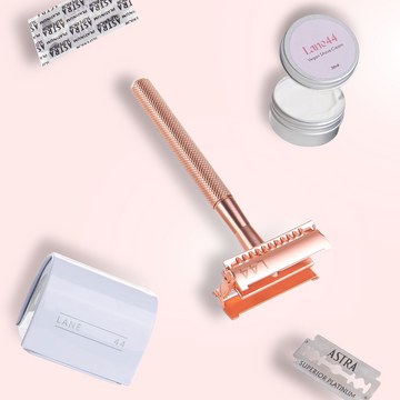 rose gold safety razor butterfly open with double edge blade recycling bin and natural shaving cream