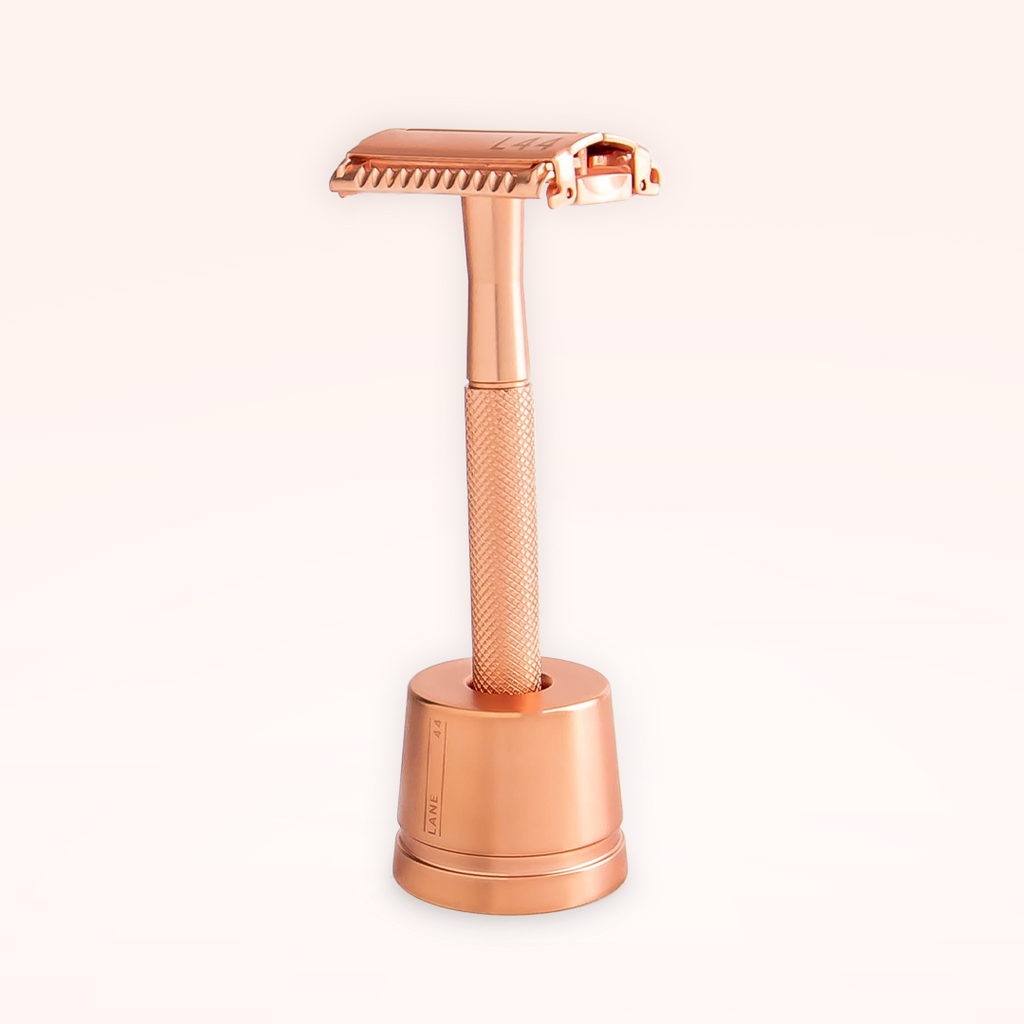 rose gold safety razor in shaving stand