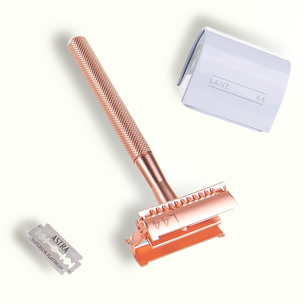 rose gold safety razor open with double edge blade recycling bin and double edge blade