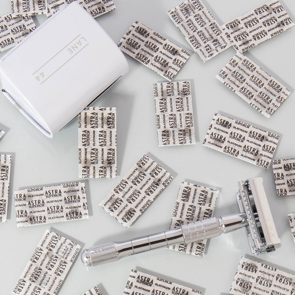 silver safety razor with recycling bin and double edge blades